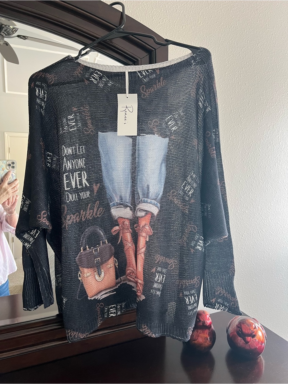 Relaxed Black Graphic Knit Sweater with Printed Boots and Bag